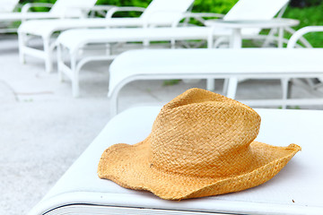 Image showing Wicker hat at pool side