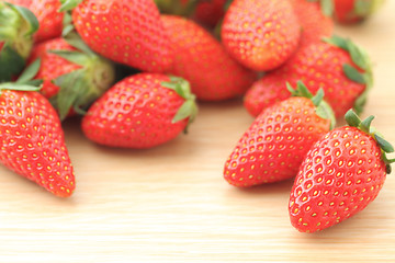 Image showing Strawberries on the wooden table