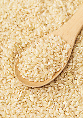 Image showing Brown rice and teaspoon