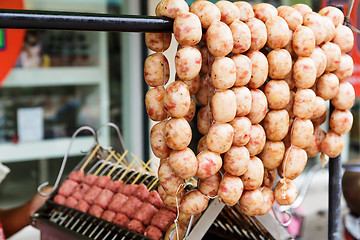 Image showing Thai style grilled sausage on street market in thailand