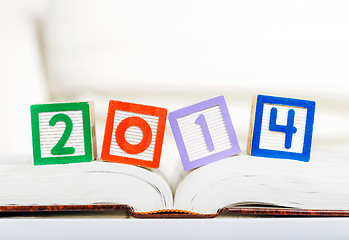 Image showing Alphabet block with 2014 on book