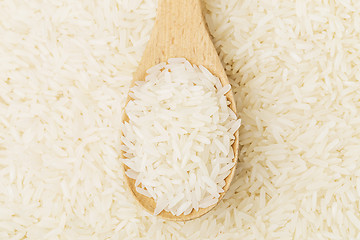 Image showing Uncooked rice on spoon