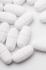 Image showing White pills isolated on white