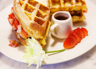Image showing Waffles with syrup and strawberries