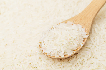 Image showing Uncooked white rice with spoon