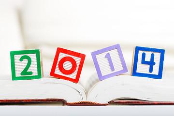 Image showing Alphabet block with 2014 on book