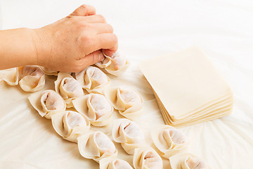 Image showing Homemade dumpling with human hand