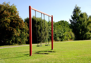 Image showing Two swings at the park