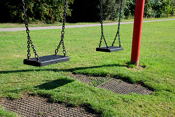 Image showing Two empty swings