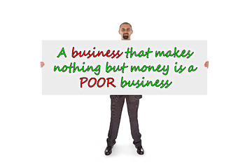 Image showing Smiling businessman holding a really big blank card