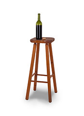 Image showing Old stool and bottle of wine isolated