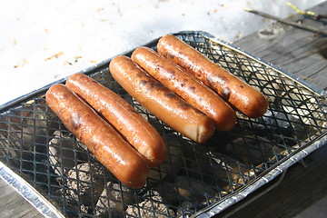 Image showing hotdogs on the barbecue