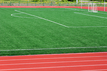 Image showing Soccer green field artificial grass with white lines 