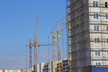 Image showing Construction site with many cranes against the sky
