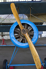 Image showing Old aircraft engine with wood propeller, vintage plane close up