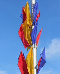 Image showing colored flags on a blue sky background