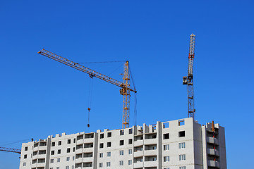 Image showing Construction site with two cranes against the sky