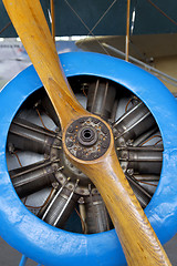 Image showing Old aircraft engine with wood propeller, vintage plane close up