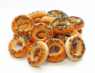 Image showing Drying bagels with poppy seeds on a white background