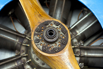 Image showing Old aircraft engine with wood propeller, vintage plane close up