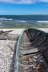 Image showing Old wooden boat on the seashore