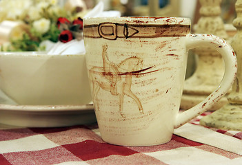 Image showing Pottery mug on a table