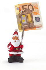 Image showing Santa clause figurine with fifty Euro