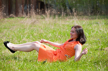 Image showing Pretty girl laying on grass