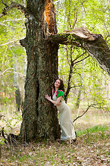 Image showing Beautiful woman near birch