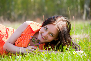 Image showing Pretty girl laying on grass