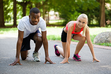 Image showing young couple runner jogger in park outdoor summer