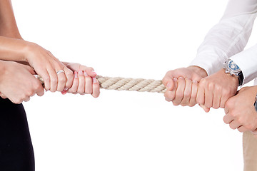 Image showing business woman against businessman pulling rope isolated