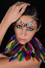 Image showing beautiful woman with colorful extreme makeup and accessoires