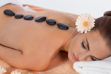 Image showing attractive healthy caucasian woman hot stone massage wellness 