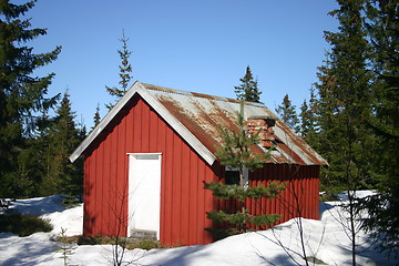 Image showing small, red, rustic cottage