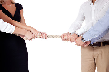 Image showing business woman against businessman pulling rope isolated