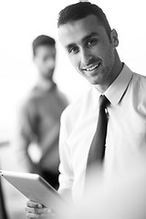 Image showing business man using tablet compuer at office