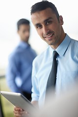 Image showing business man using tablet compuer at office