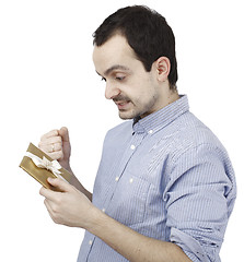 Image showing Young man holding a present