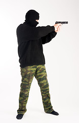 Image showing masked man aims with gun
