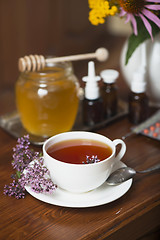 Image showing Still life from medicinal herbs, honey, herbal tea and medicines