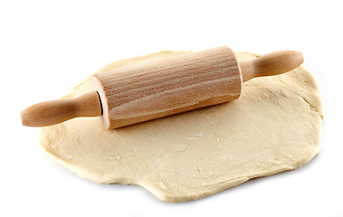 Image showing Wooden rolling pin and dough