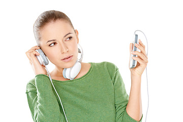 Image showing Woman listening to a new music download