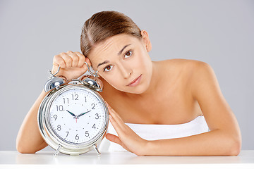 Image showing Bored young woman counting down the time