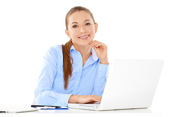 Image showing Smiling businesswoman working on a laptop