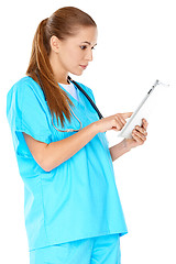 Image showing Doctor checking information on a tablet