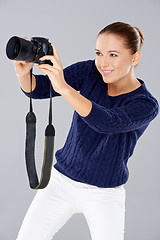 Image showing Pretty vivacious young female phoptographer