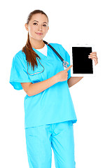 Image showing Smiling nurse pointing to a tablet-pc