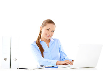 Image showing Smiling businesswoman working on a laptop