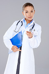 Image showing Young woman doctor pointing at the camera